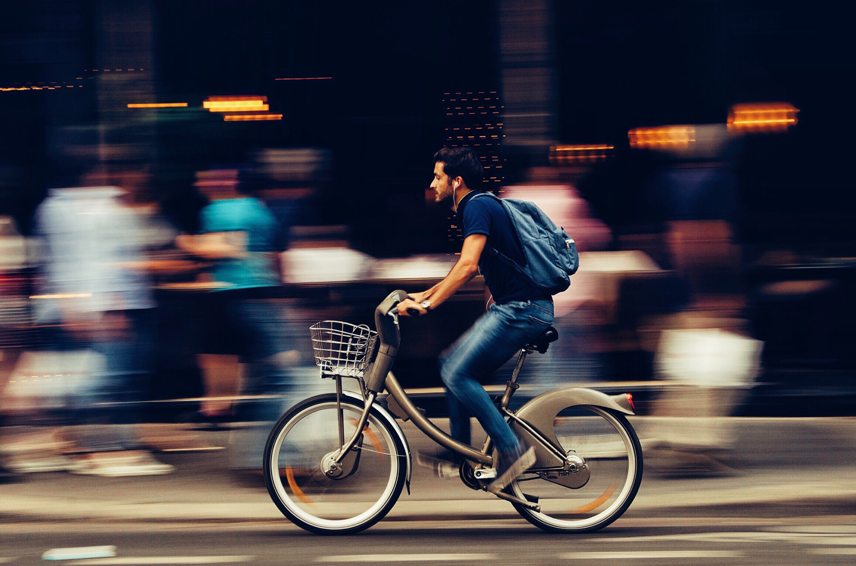 man-riding-bicycle-on-city-street-310983