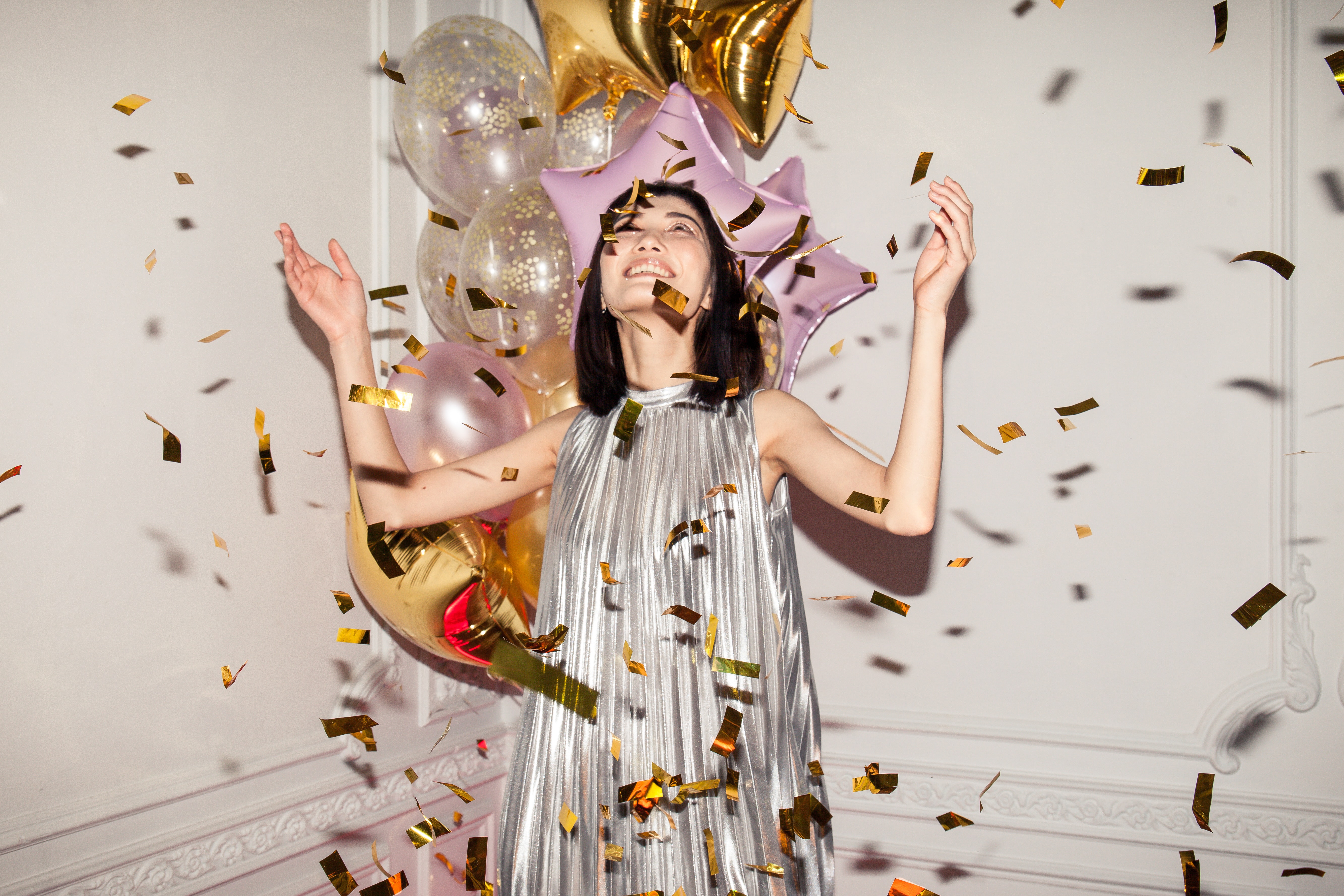 woman-looking-at-falling-confetti-3419692